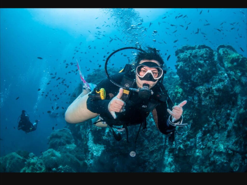 Female having a fun scuba dive in Thailand, Koh Tao